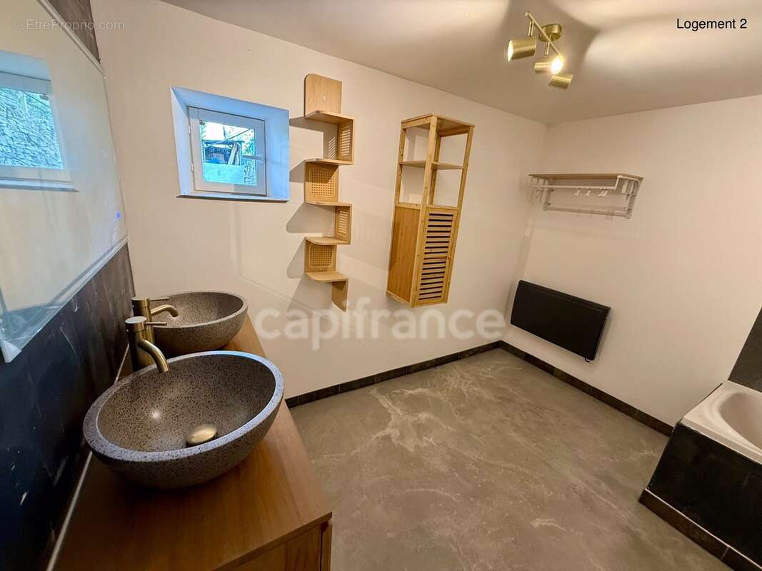 Maison avec deux logements indépendants : une opportunité rare pour habiter, investir ou réunir plusieurs générations - photo 31