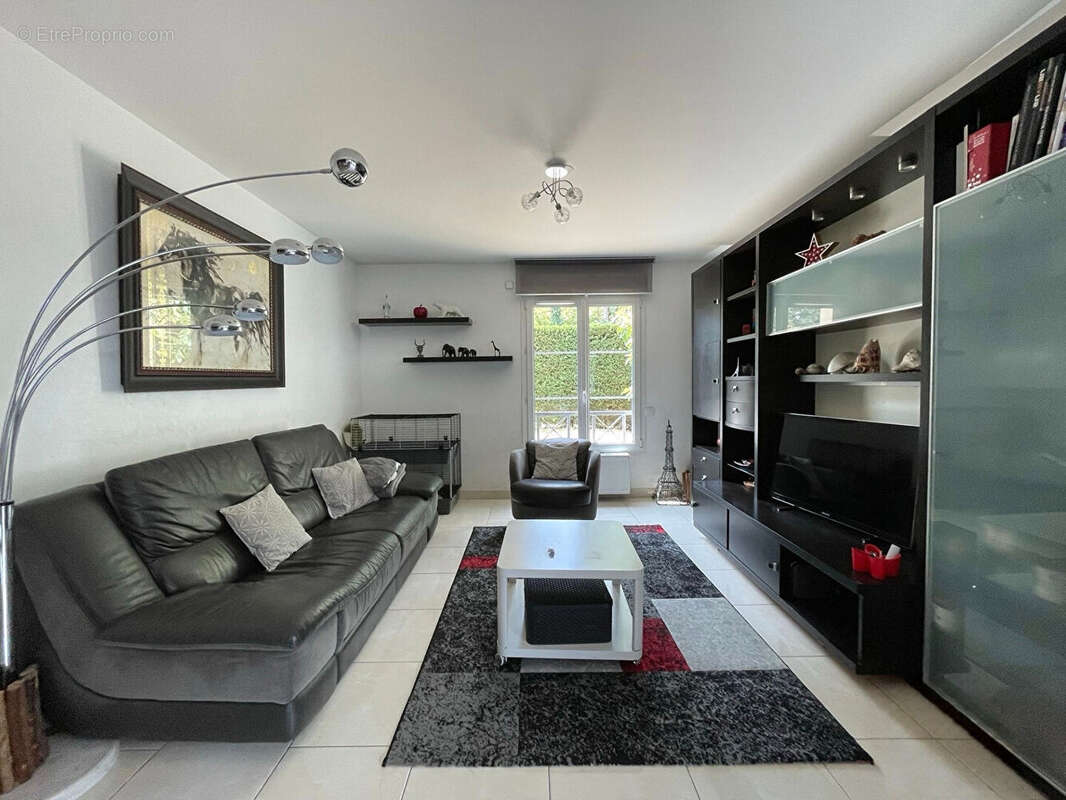 Appartement en rez-de-jardin avec garage, parking, cave, terrasse et jardin - photo 2