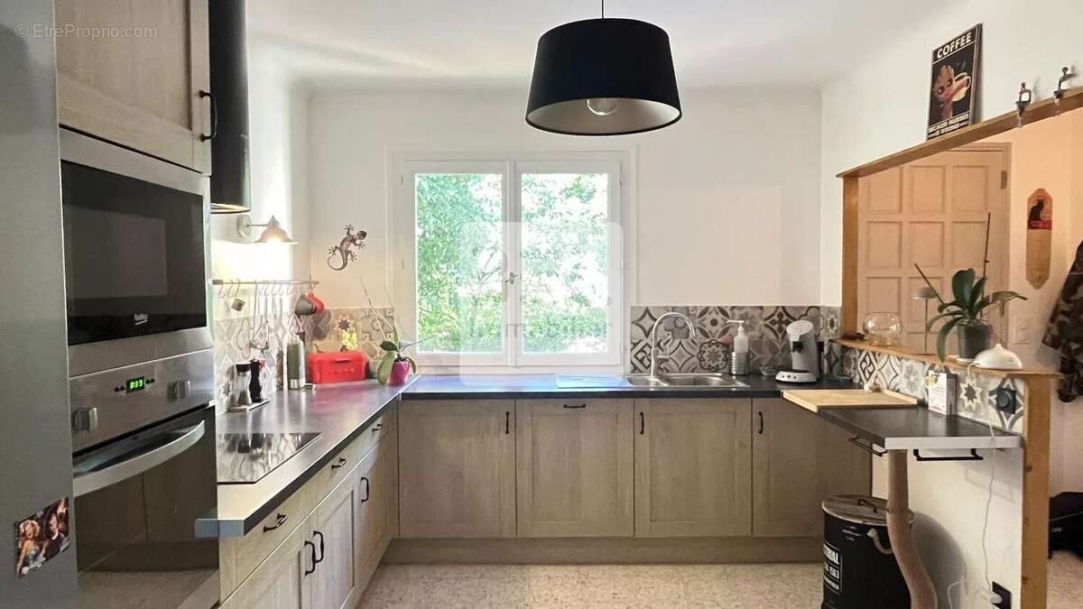 Maison à LAUDUN-L'ARDOISE