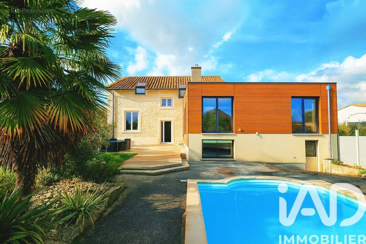 Photo 1 - Maison à FONTAINE-LE-COMTE