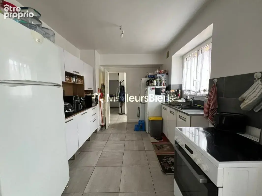 Ensemble immobilier - 134 m² composé d'une maison louée (T4) et d'une maison libre (T2) + grange et garages - photo 4