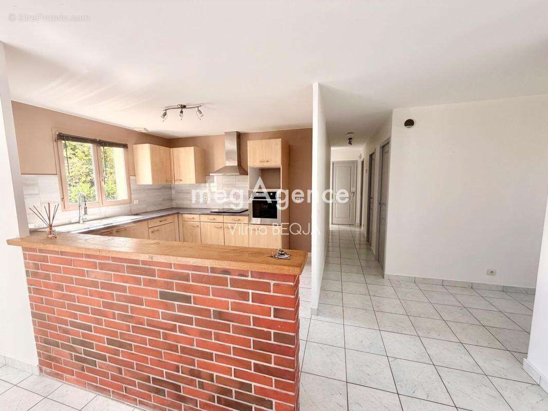 Maison de plain-pied 103 m² – 4 chambres – Garage – Terrain de 1 100 m² - photo 4
