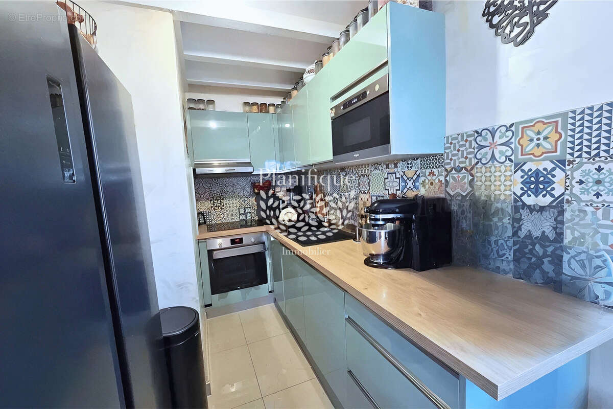 Appartement à PERON