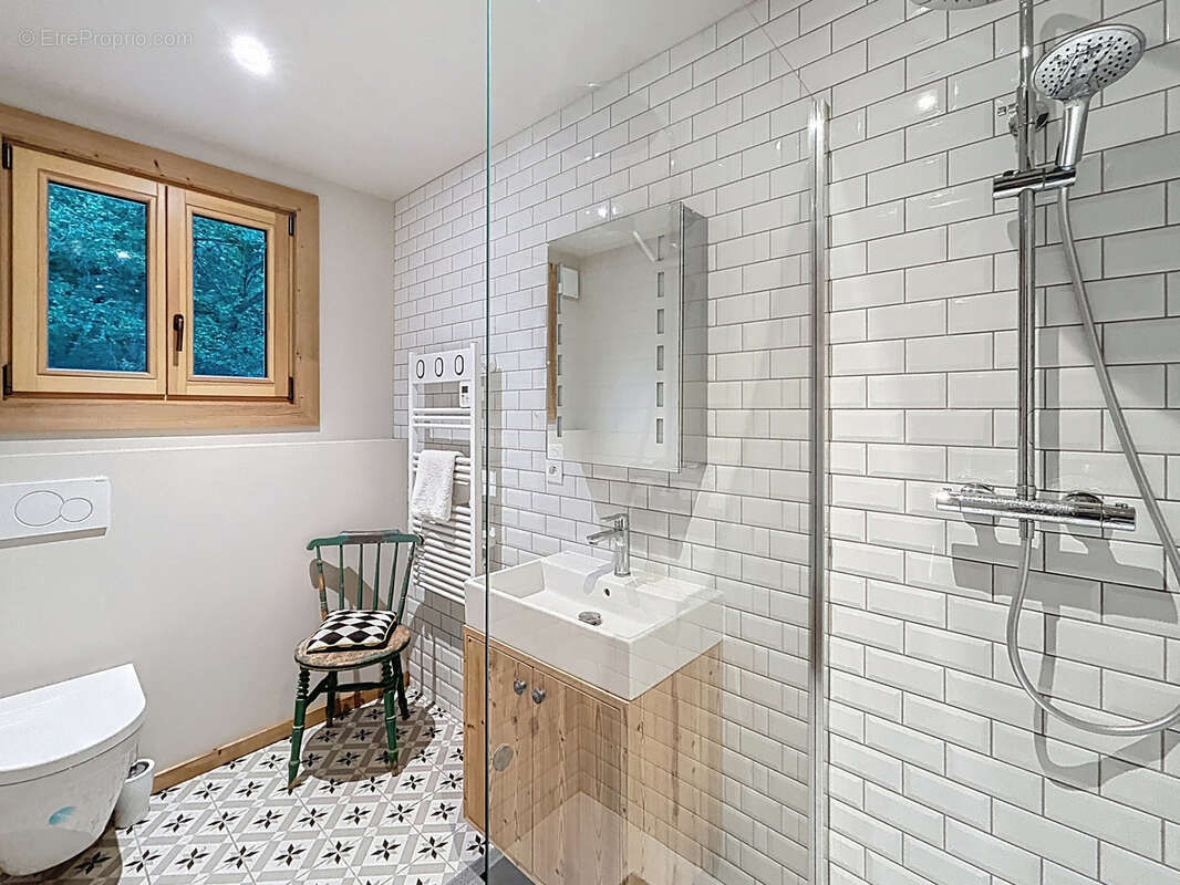 Les Gets - Appartement T4 de 92 m2 - Rez-de-jardin - photo 8