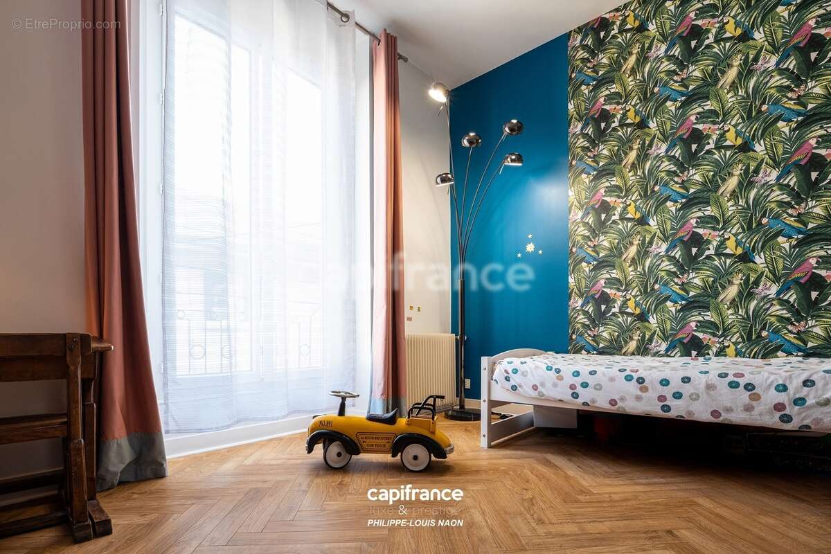 Appartement de style haussmannien d'exception avec grande pièce à vivre de plus de 70m2 - photo 6