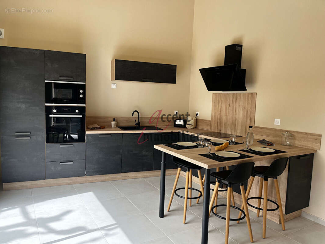 EXCLUSIVITE : Maison plain pied avec jardin T2 Bis (mezzanine) et places de parking - photo 3