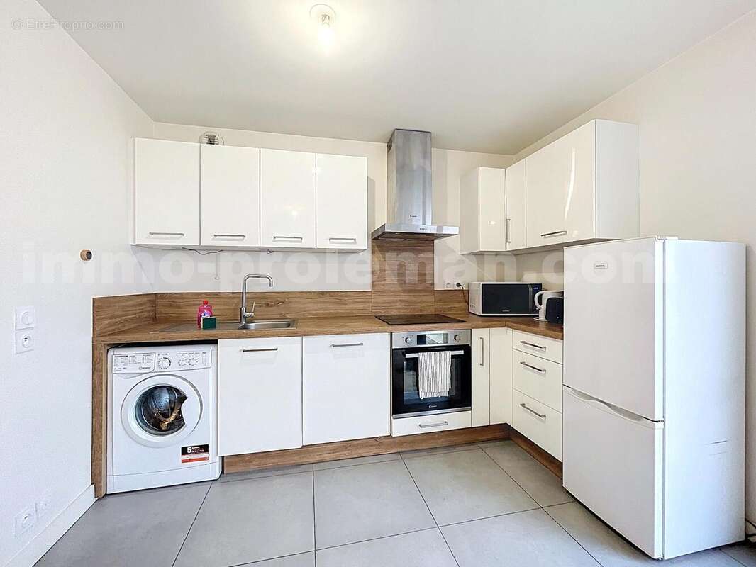 Appartement_T3_Annemasse_Genève_Ceva_tramway_Suisse_investissement_hyper_centre_Séjour_balcon_cuisine_ - Appartement à ANNEMASSE