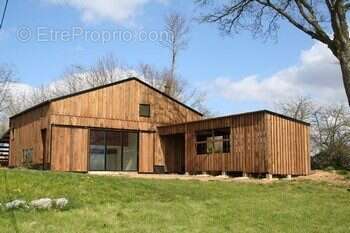 Photo construction bois possible, non contractuelle - Terrain à GUISSENY