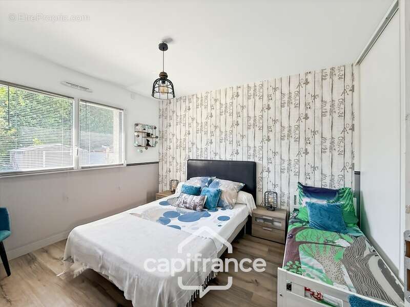 Maison contemporaine de plain-pied de 160 m² – 4 chambres – Véranda de 27 m² avec spa – Double garage – Carport – Noyal-Pontivy - photo 19