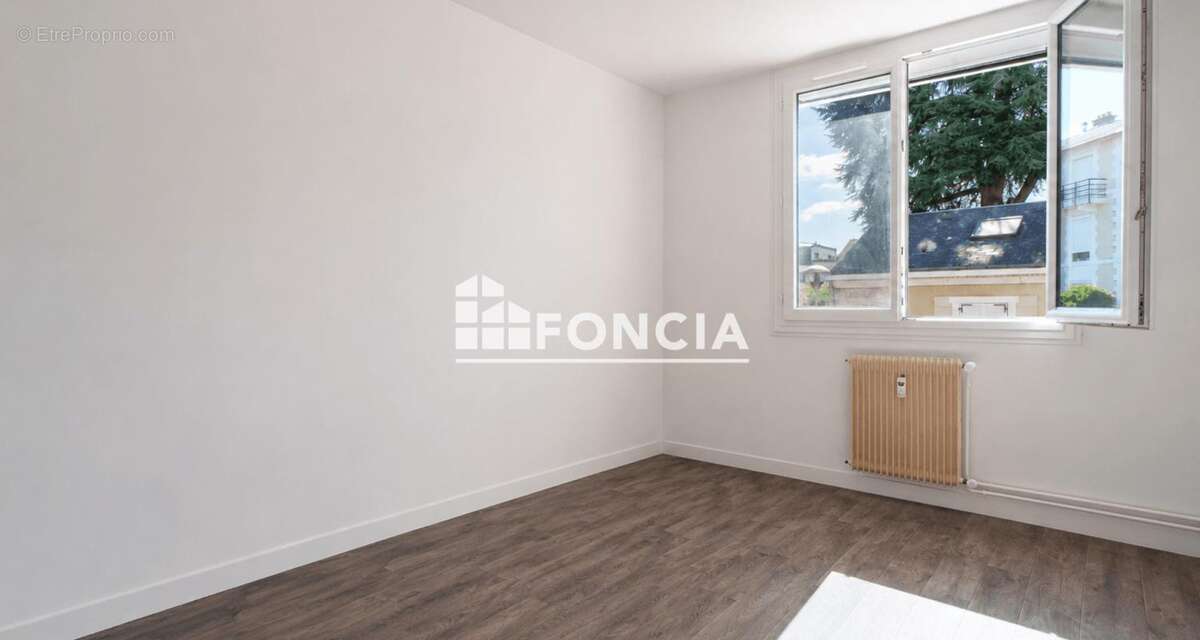 Appartement T3 de 64 m² avec balcons, parking et cave – Rue Casimir Rançon - photo 4