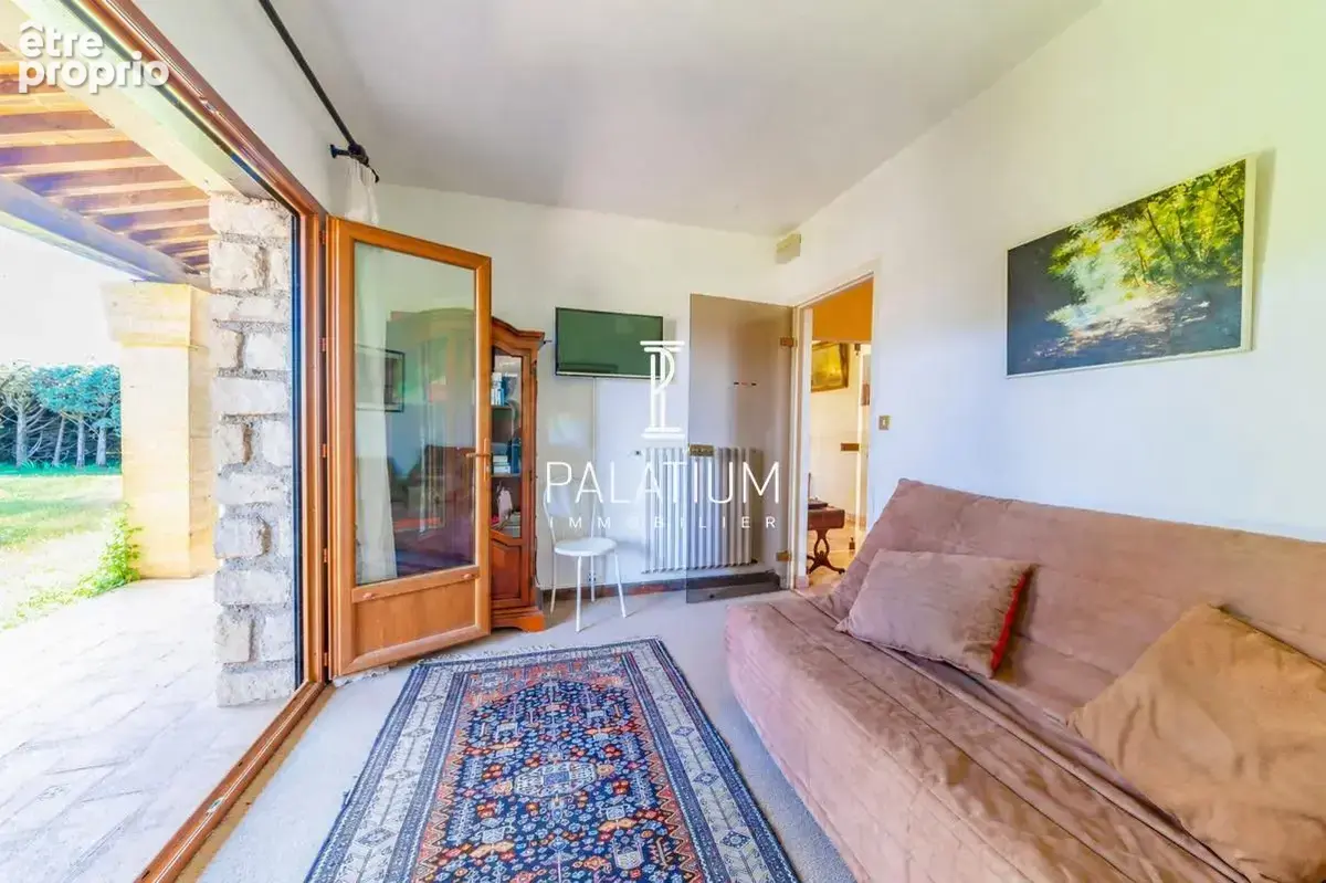 Maison de plain-pied avec jardin arboré et 3 appartements - photo 10