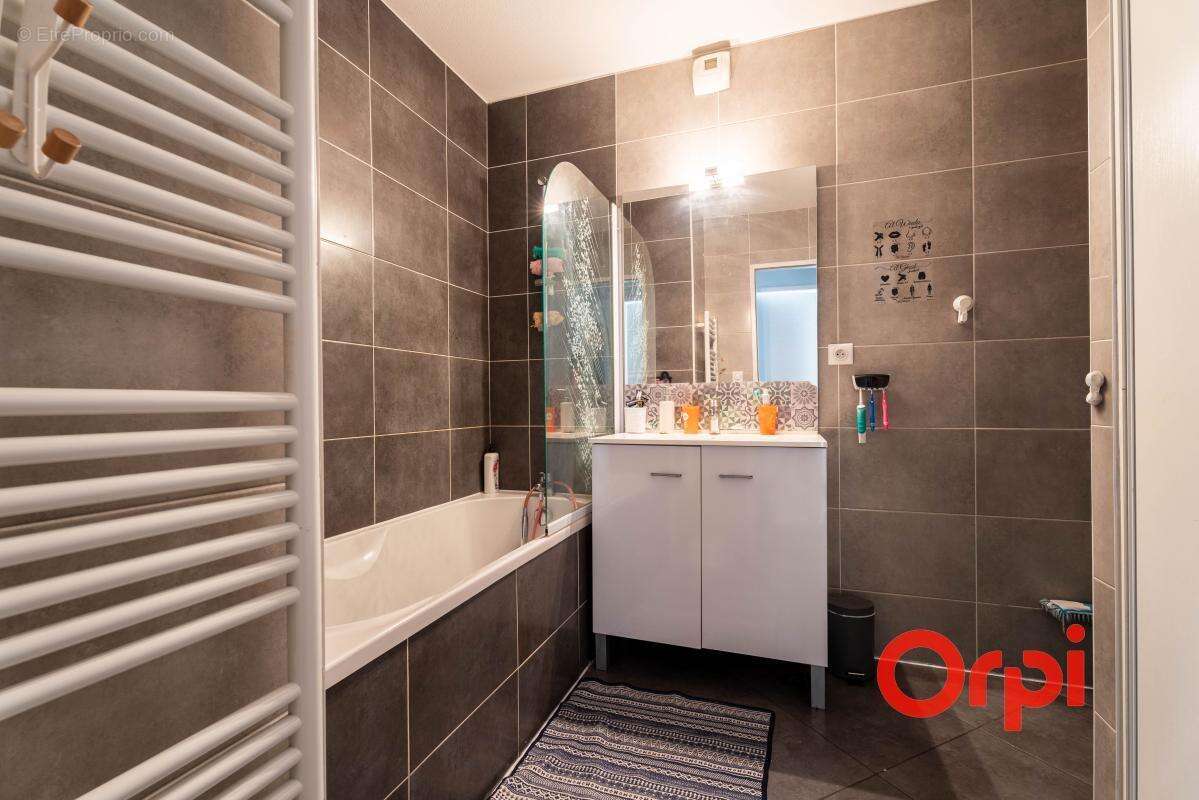 Appartement en rez-de-jardin avec un garage - photo 14