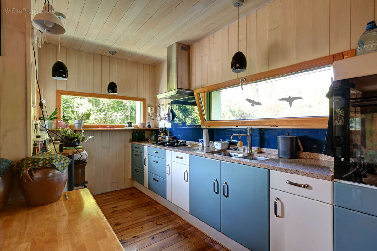 Maison bioclimatique à ossature bois avec gîte, piscine naturelle et autonomie énergétique - photo 7