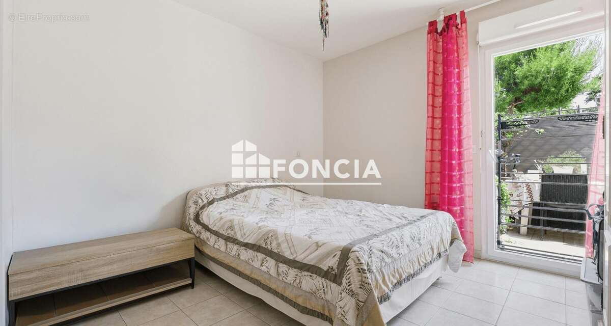 Appartement 2 pièces de 42m2 en rez-de-jardin avec terrasse et parking - loué - photo 7