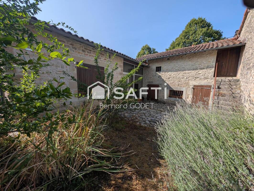 Photo 1 - Maison à BIOUSSAC