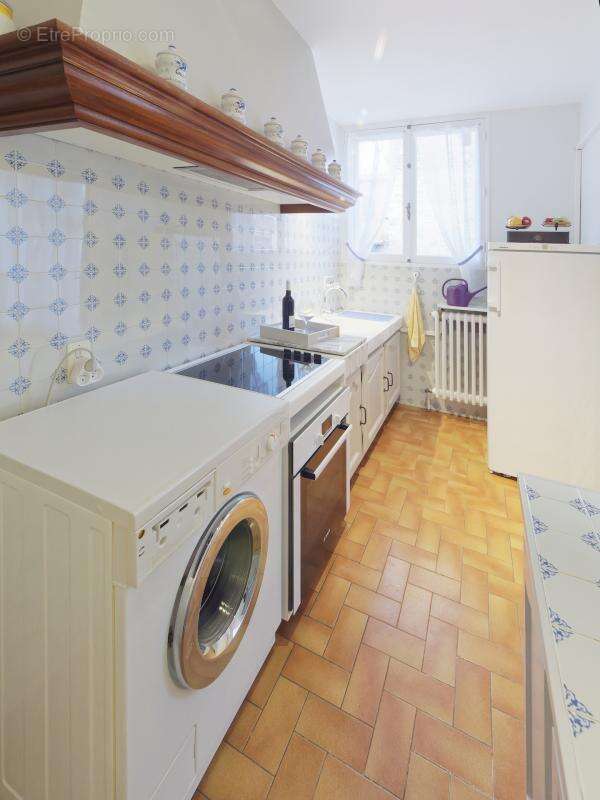 Immeuble avec 2 appartements + garage + caves - photo 11