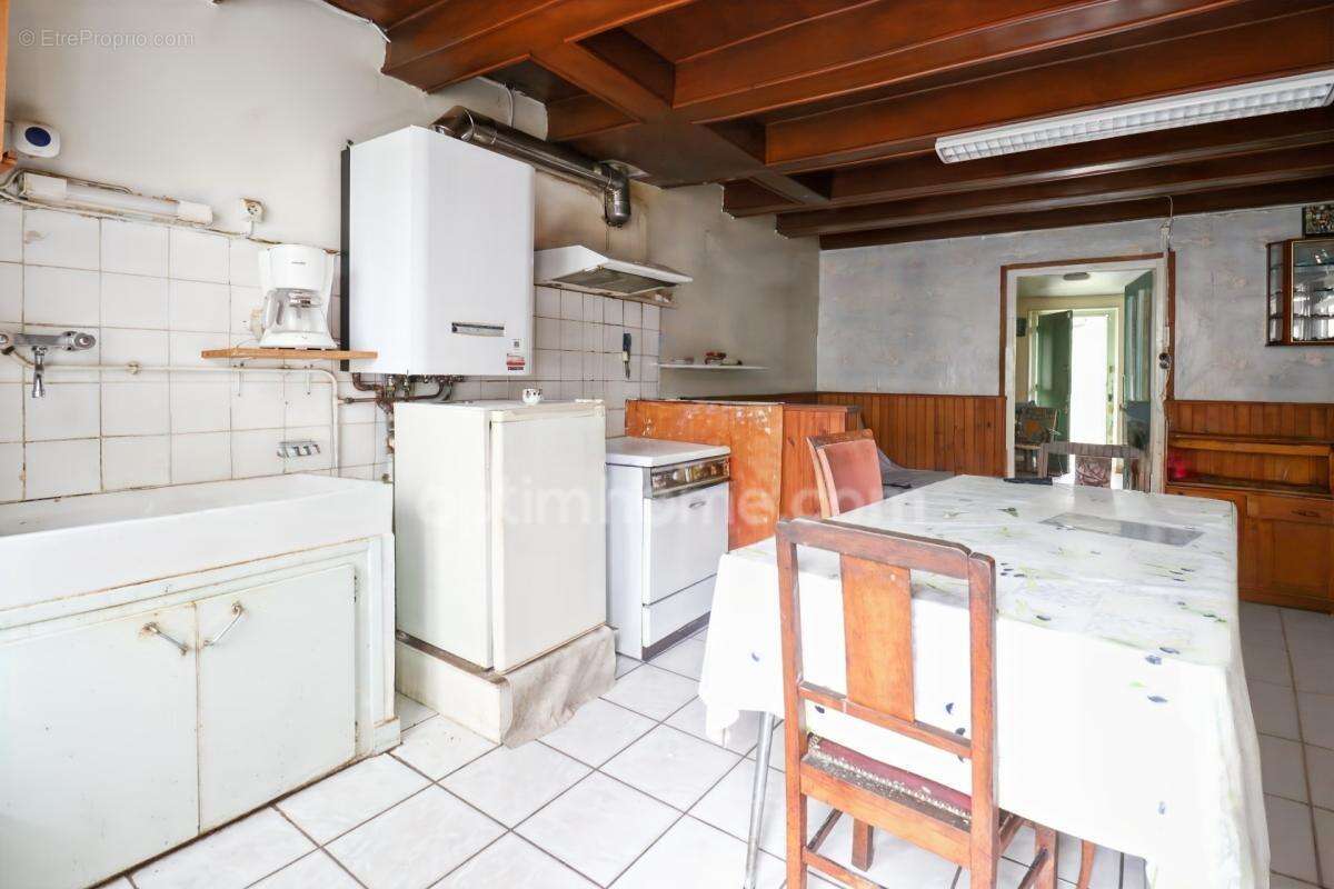 Maison de Ville sur deux niveaux - 3 pièces - 2 chambres  - Dépendance - Garage - Terrain 609 m²  - 87210 LE DORAT - photo 4