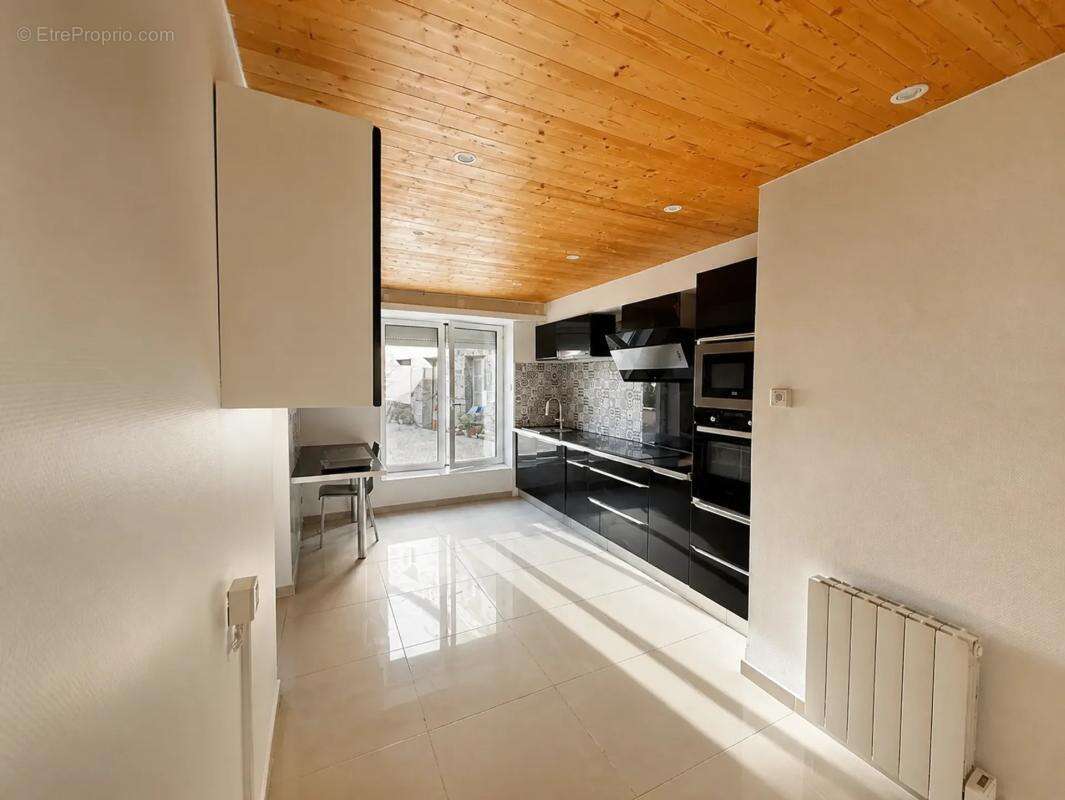 Maison de 4 pièces de 95 m² à Plussulien - photo 5