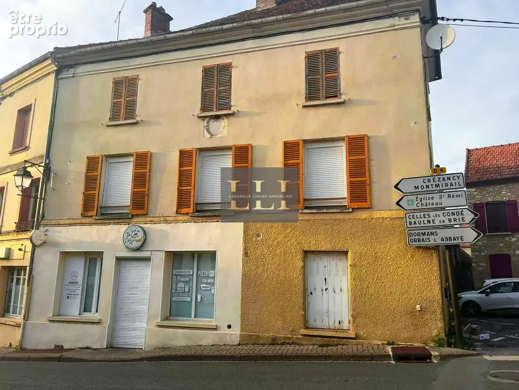 Immeuble de 170m2 avec local commercial et 2 appartements - photo 2