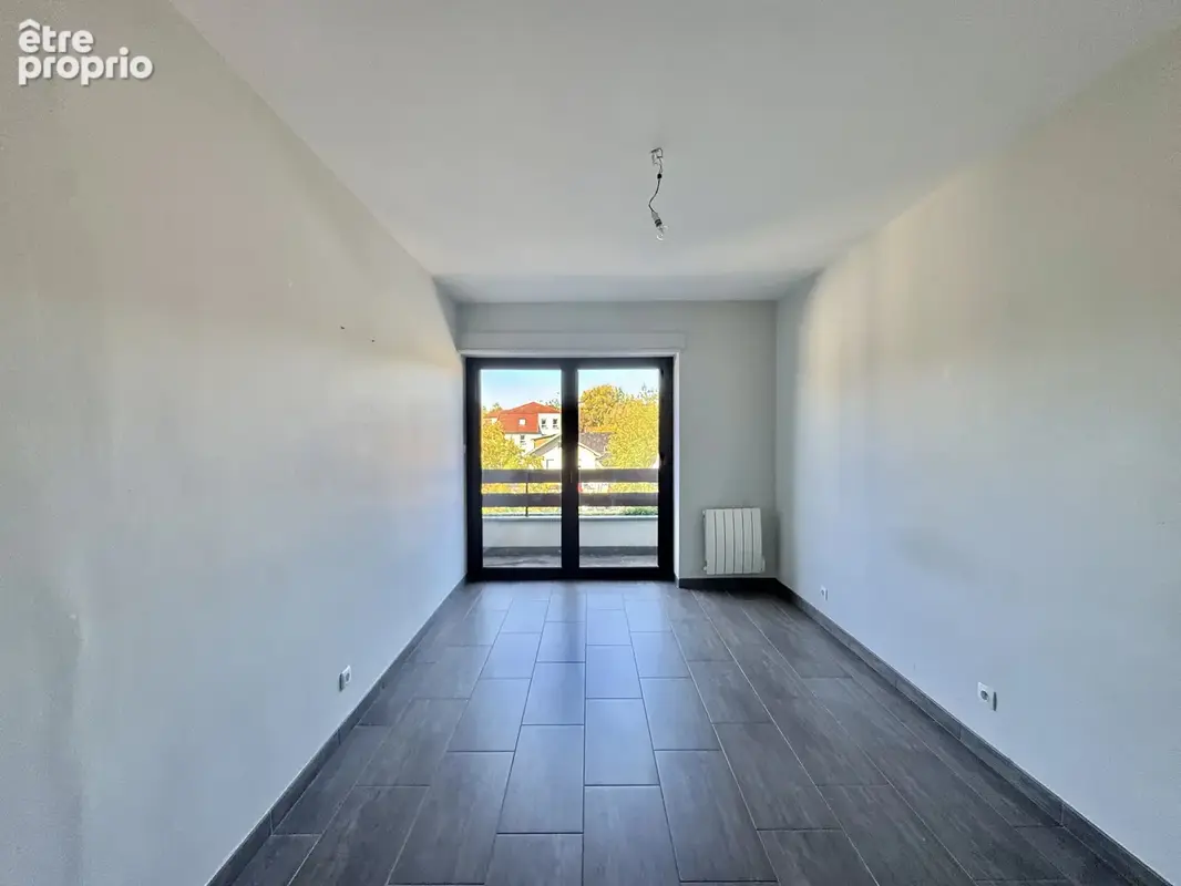 ZILLISHEIM - Centre ville, 4 pièces avec balcons, parking et cave - photo 9