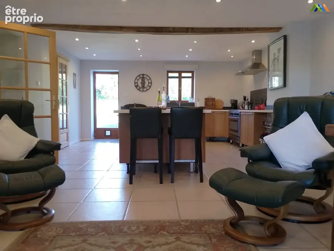 Bright open-plan living and dining room overlooking the garden