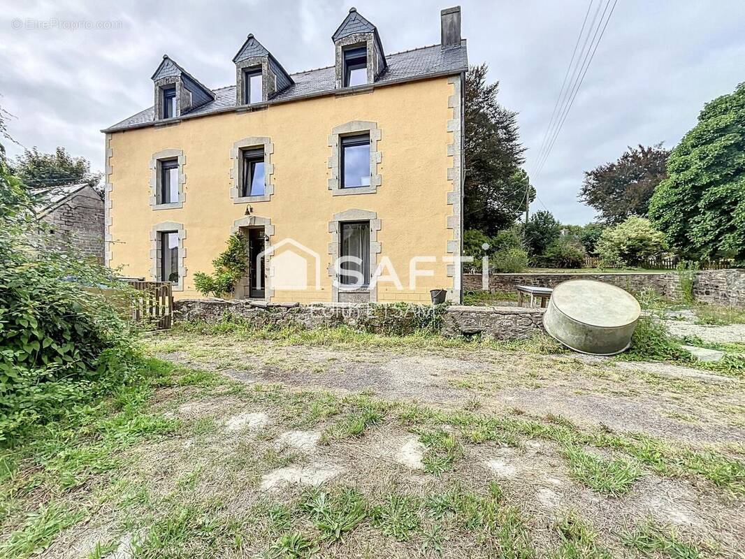 Photo 1 - Maison à PLUGUFFAN