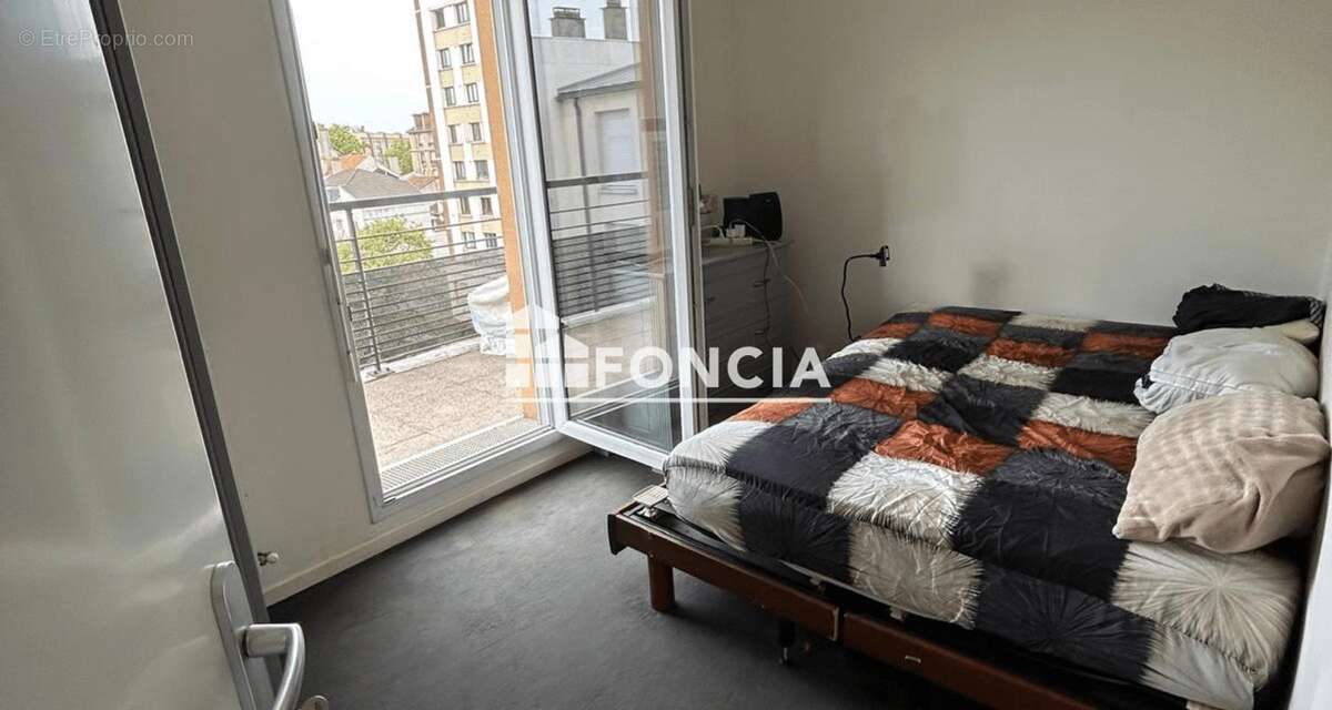 T3 56M2 Séjour, 2 chambres , balcon et place de Parking - photo 4