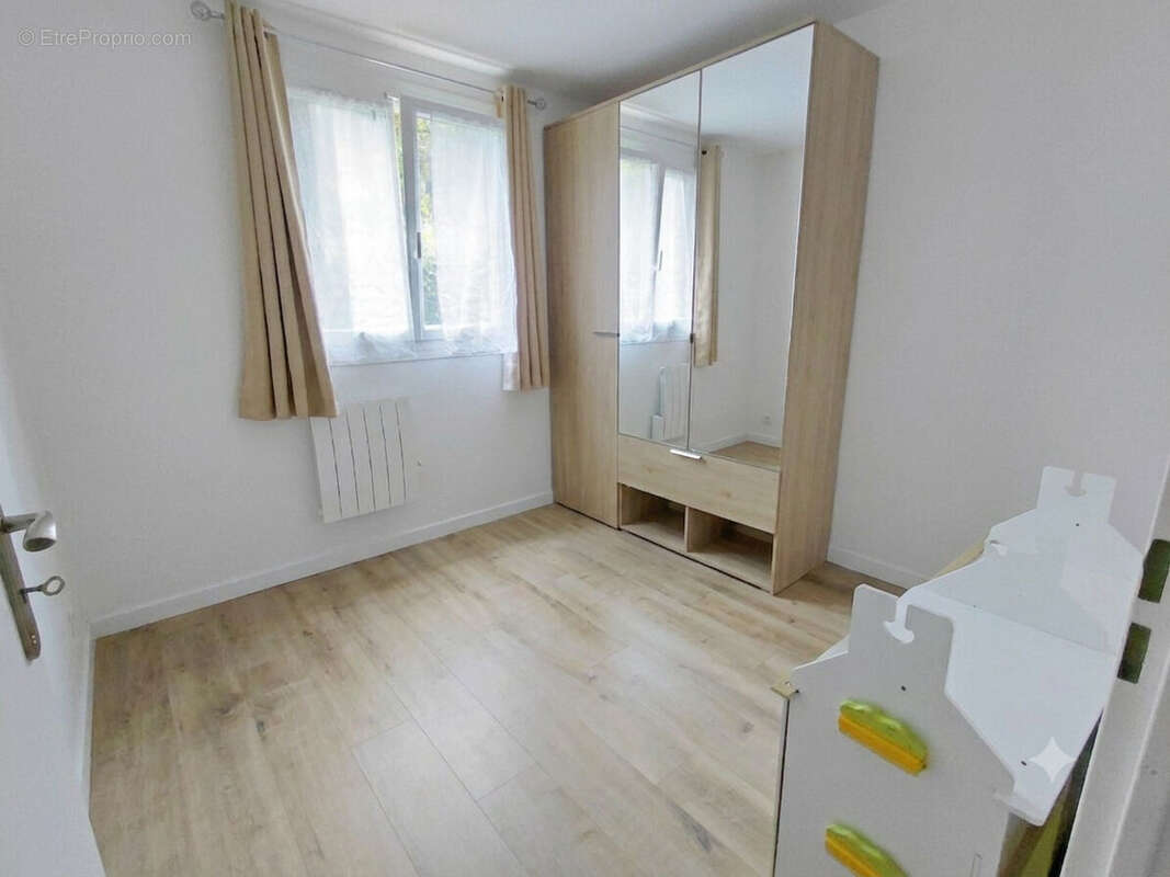 Appartement  76 m² en rez-de-jardin (3 chambres) - photo 5
