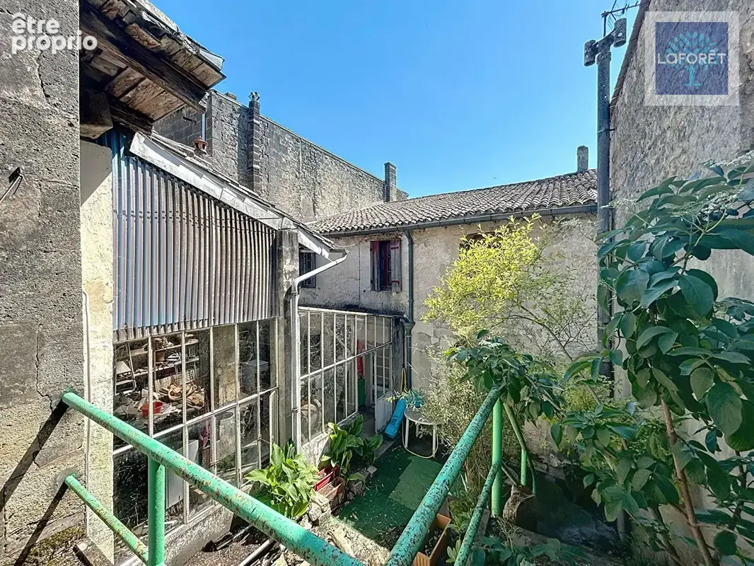 Immeuble avec local commercial et 5 chambres - photo 13