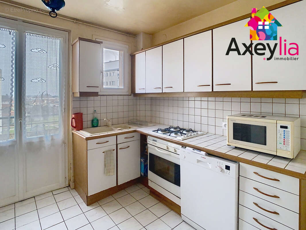 A vendre- roanne- appartement t5 avec balcon, cave et cellier - photo 2