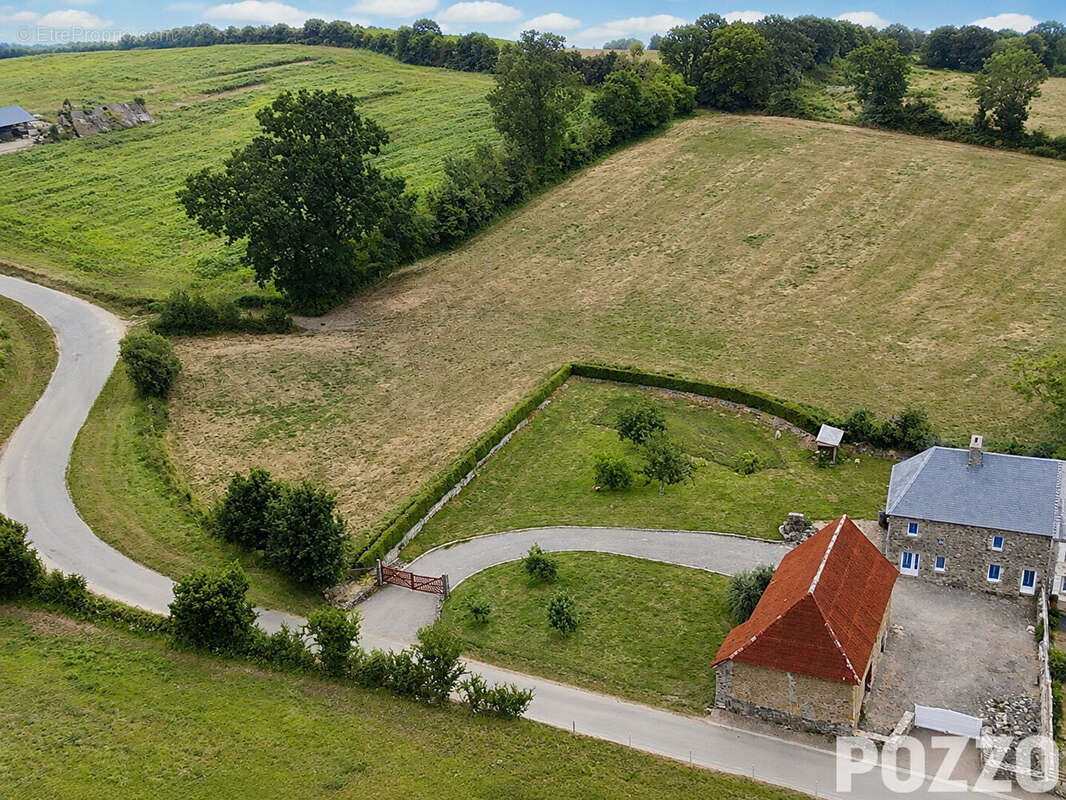 EXCLUSIVITÉ : Charmante maison en pierre à Saint-Sauveur-Villages avec beau terrain arboré et dépendances, 88.9 m2, 3ch. - photo 18