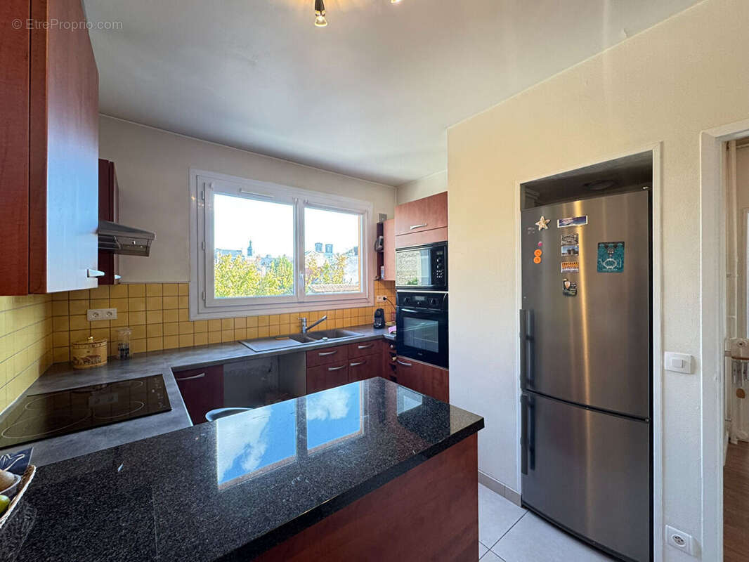 Appartement traversant type 5 - 112.4 m² - secteur buirette - photo 7