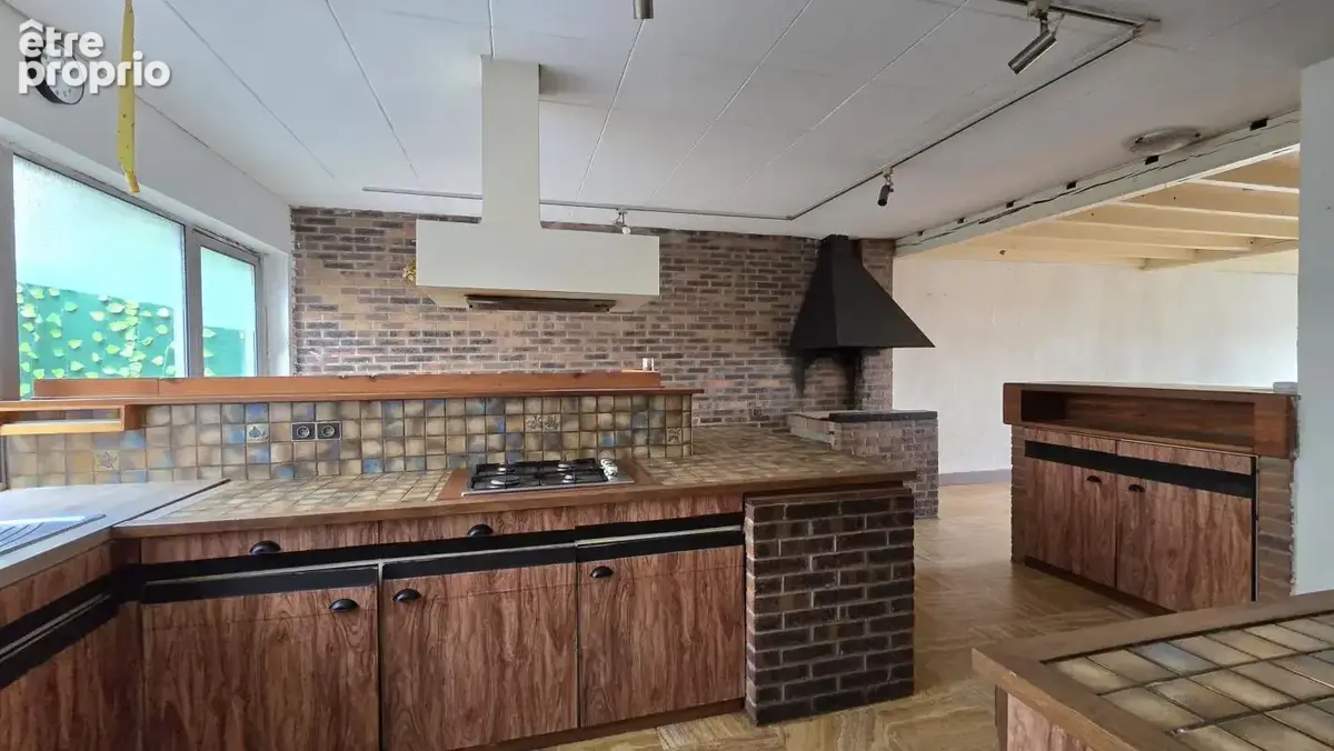 Immeuble comprenant une surface commerciale, une maison et un garage, situé en centre ville de Fourmies - photo 7