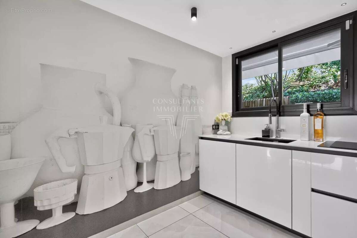 Appartement d'exception en rez-de-jardin. - photo 9