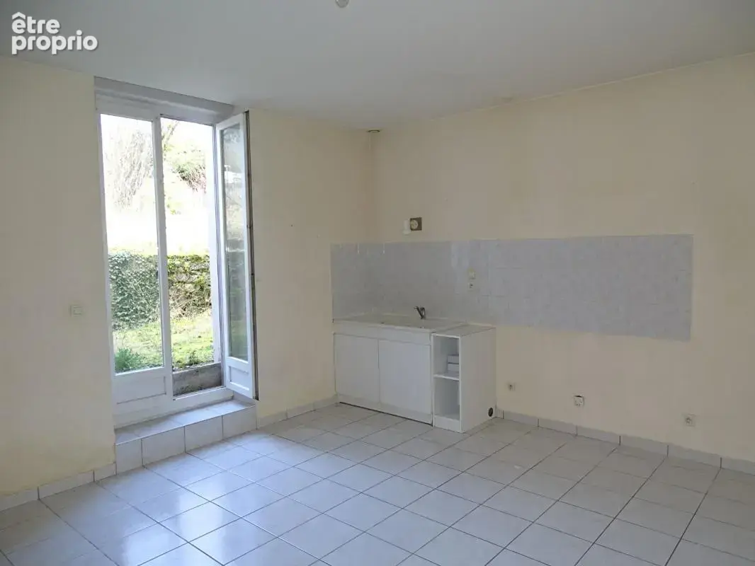 Immeuble comprenant 4 appartements + caves, jardin et parkings - photo 5
