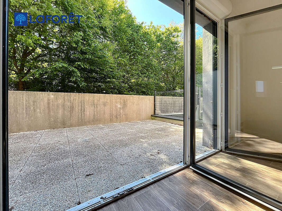 Au Centre de Guidel, Appartement 68m²,  2 chambres, terrasse, jardin, 2 stationnements - photo 4