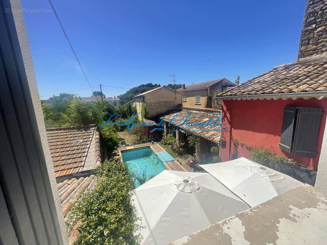 ST CHRISTOL LES ALES, maison en pierres F5 avec dépendances, chalet, piscine sur 2482 m2 de terrain avec puit - photo 9