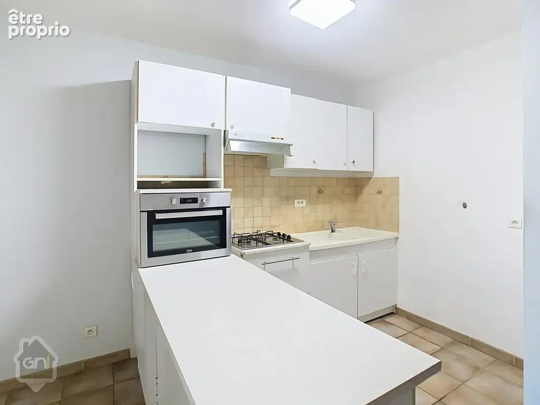 Appartement en rdc - avec parking - photo 6