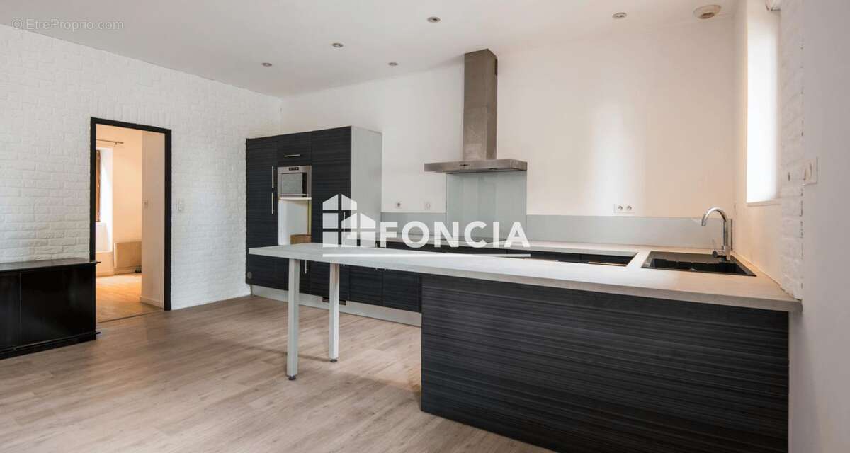 Esprit loft pour ce 3 pièces quartier Faubourg - photo 2