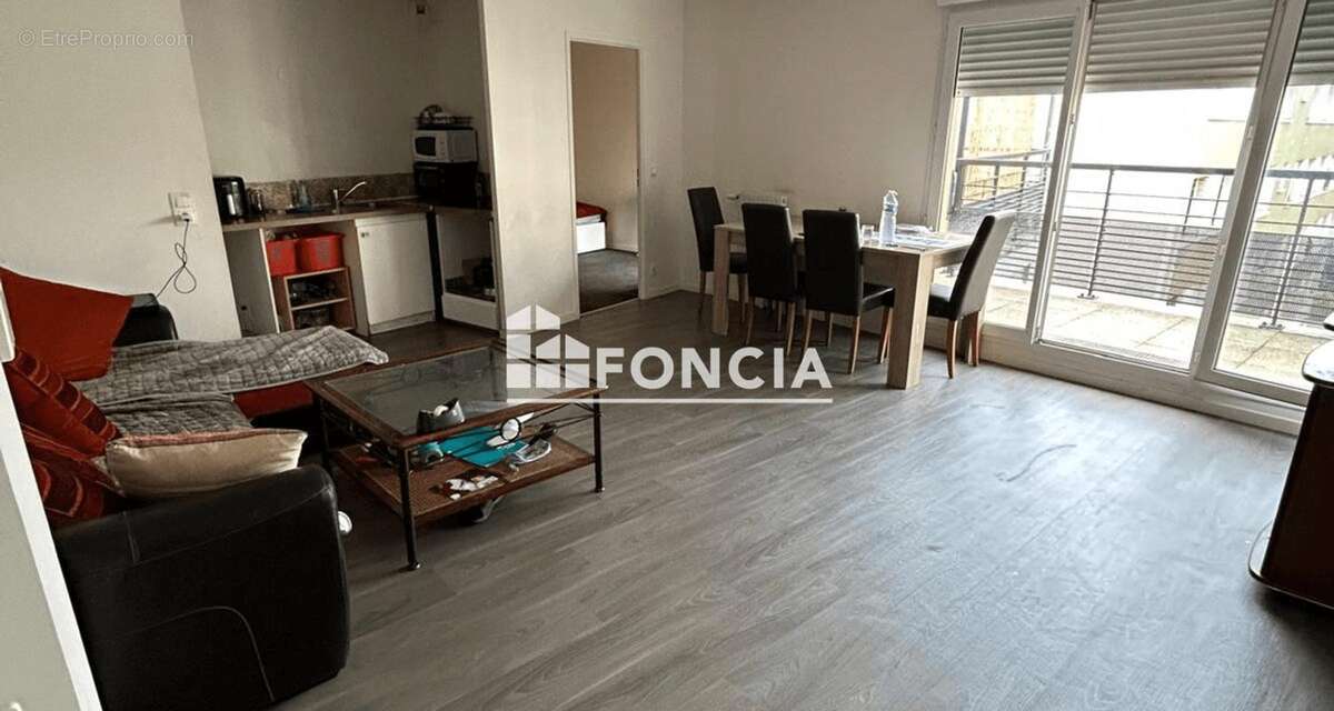 T3 56M2 Séjour, 2 chambres , balcon et place de Parking - photo 2