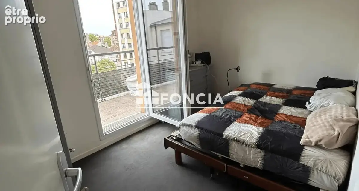 T3 56M2 Séjour, 2 chambres , balcon et place de Parking - photo 4