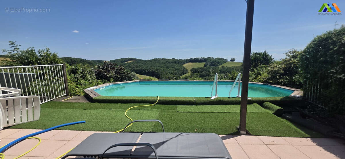 Swimming pool terrace with far-reaching countryside views