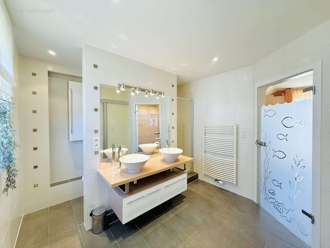 Berstett - L’esprit maison dans une petite copropriété   5 pièces de 141,63 m2 avec jardin, terrasse, garage - photo 12