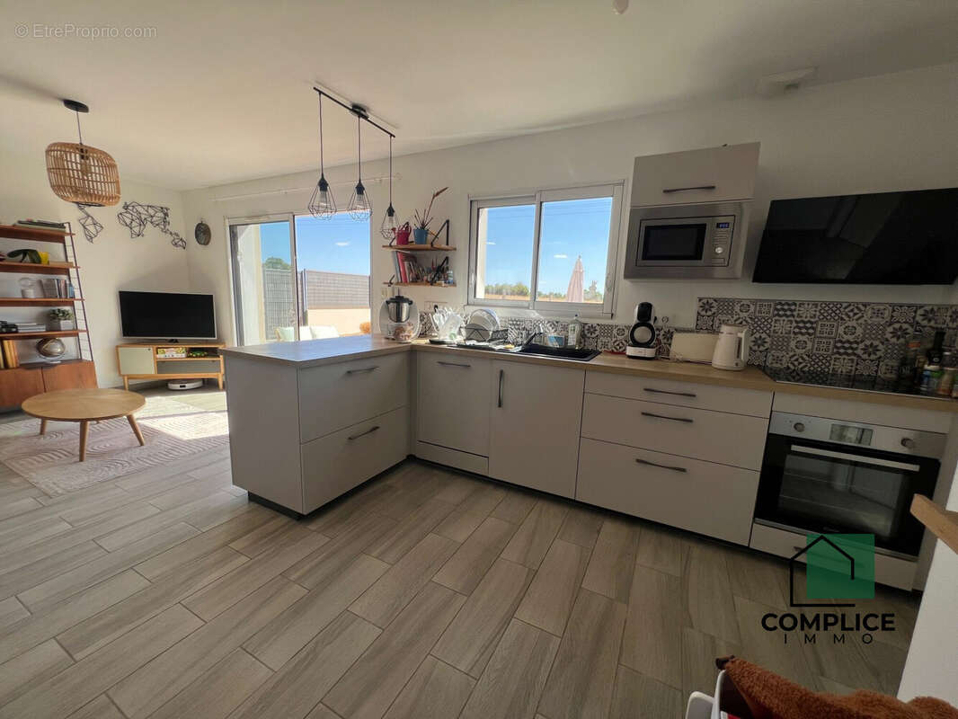 Maison 90 m² à Saint-Etienne-De-Montluc  - photo 6