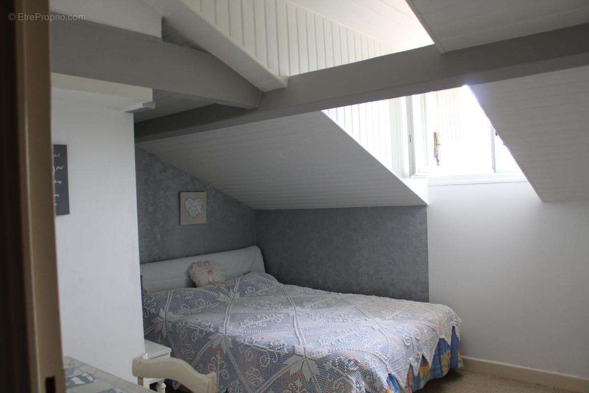 Maison sur deux niveaux avec sous sol - photo 7