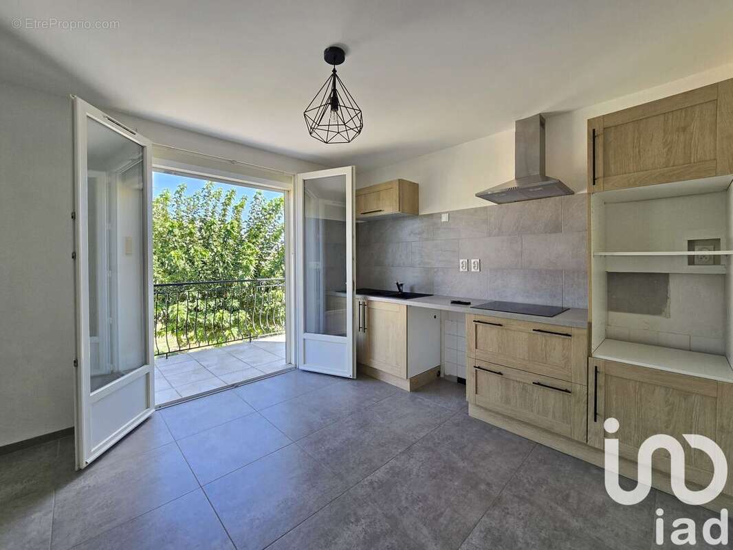 Photo 3 - Maison à LAUDUN-L&#039;ARDOISE