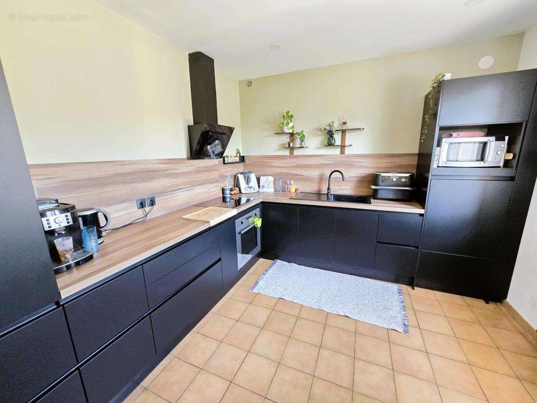 maison de 5 pièces de 124m² - photo 3