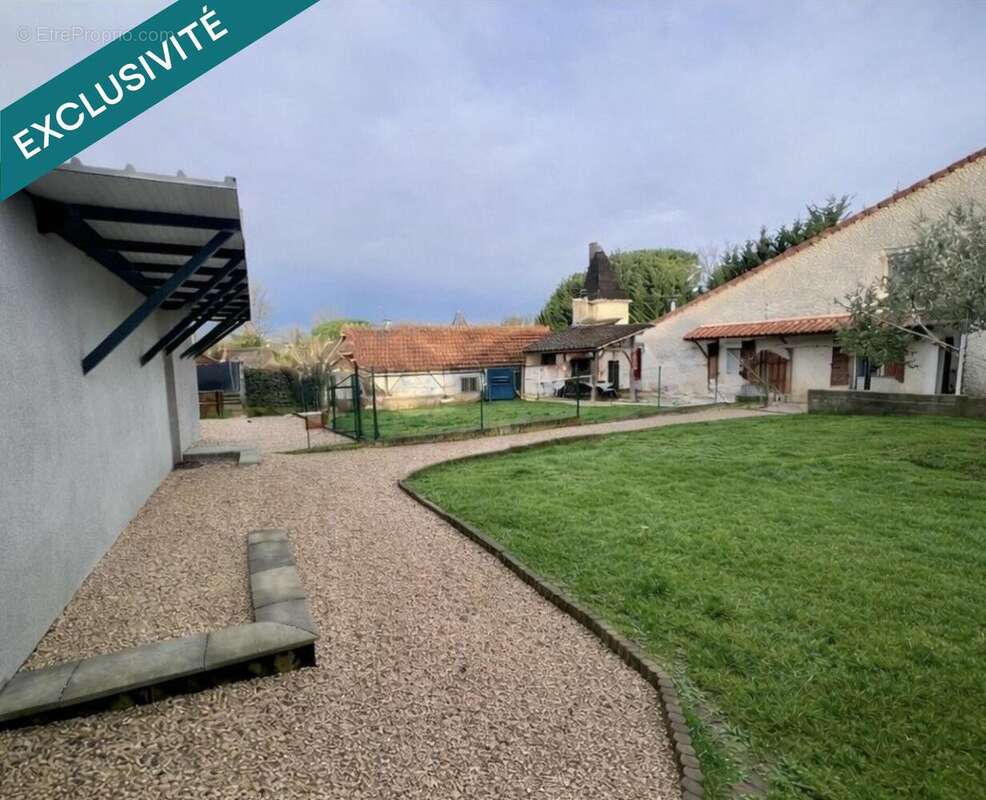 Photo 2 - Maison à VIC-FEZENSAC