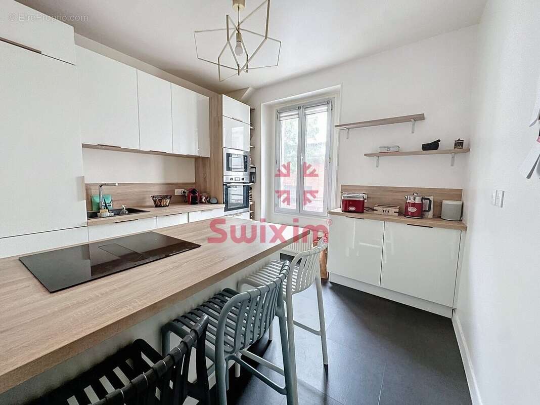 3472849_866788_photo_2.jpg - Appartement à PARIS-20E