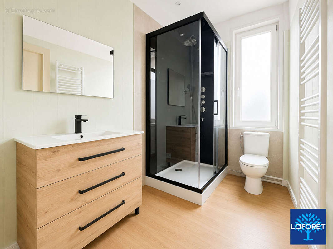 Appartement 2 chambres entièrement rénové - photo 7
